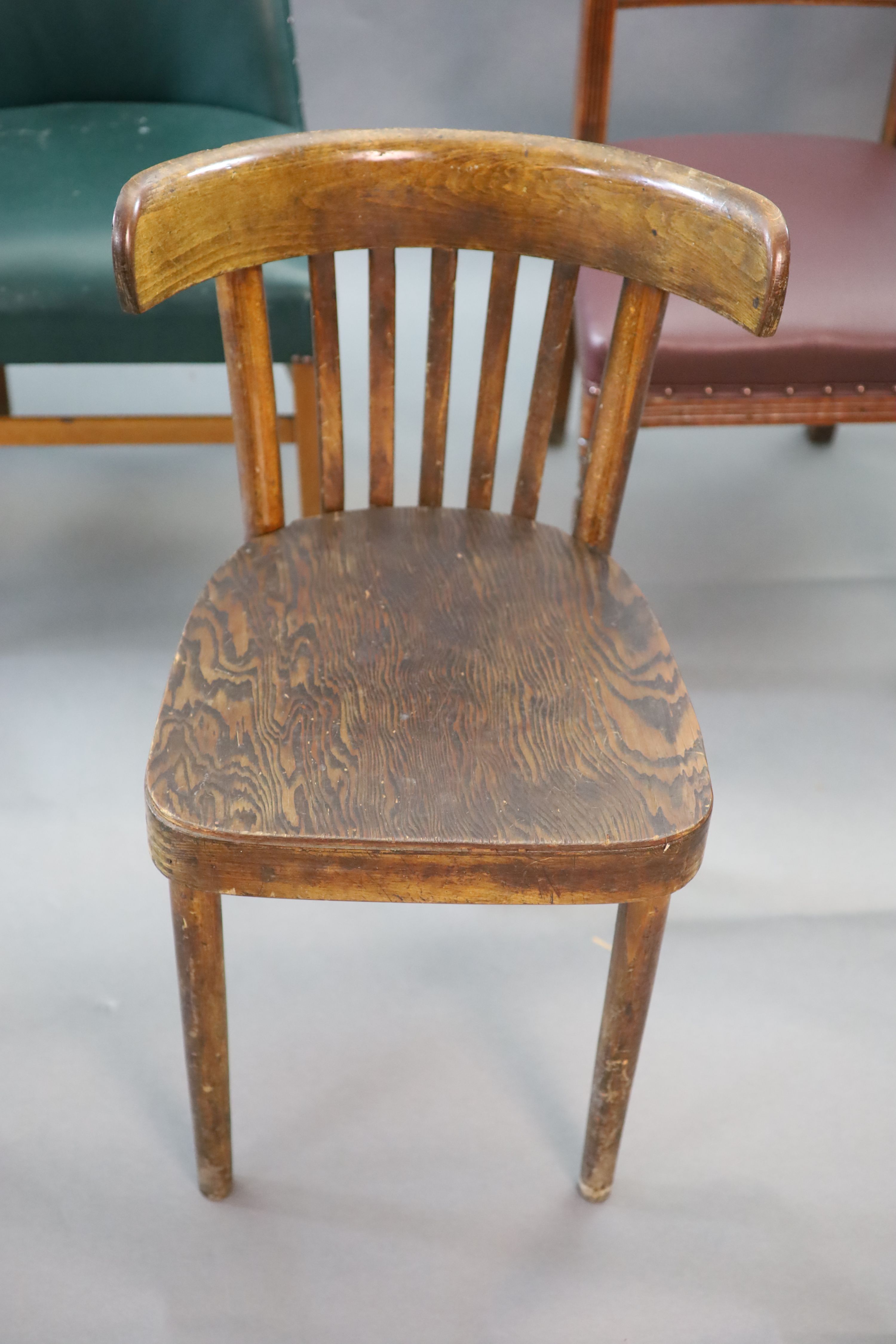 Six chairs from the Libary of the Royal College of Surgeons, including two Victorian balloon back, a marquetry inlaid Edwardian example and a 1940's green leatherette example